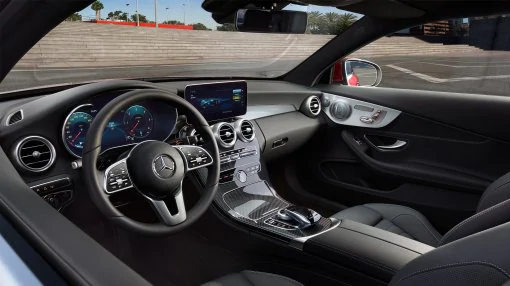 The image shows the cockpit with steering wheel in the A-Class. 